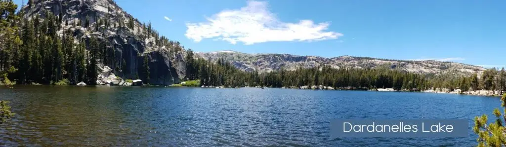 a lake surrounded by mountains and trees