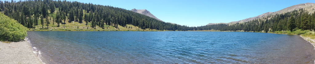 a lake surrounded by mountains and trees