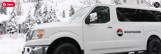 a white van is parked in the snow