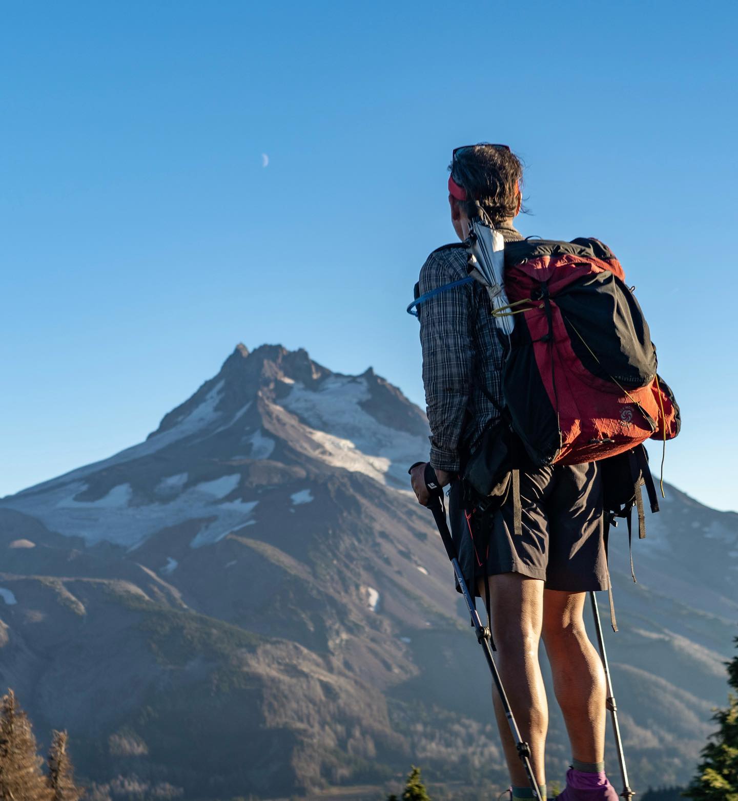 Backpacker staring at the Mountains