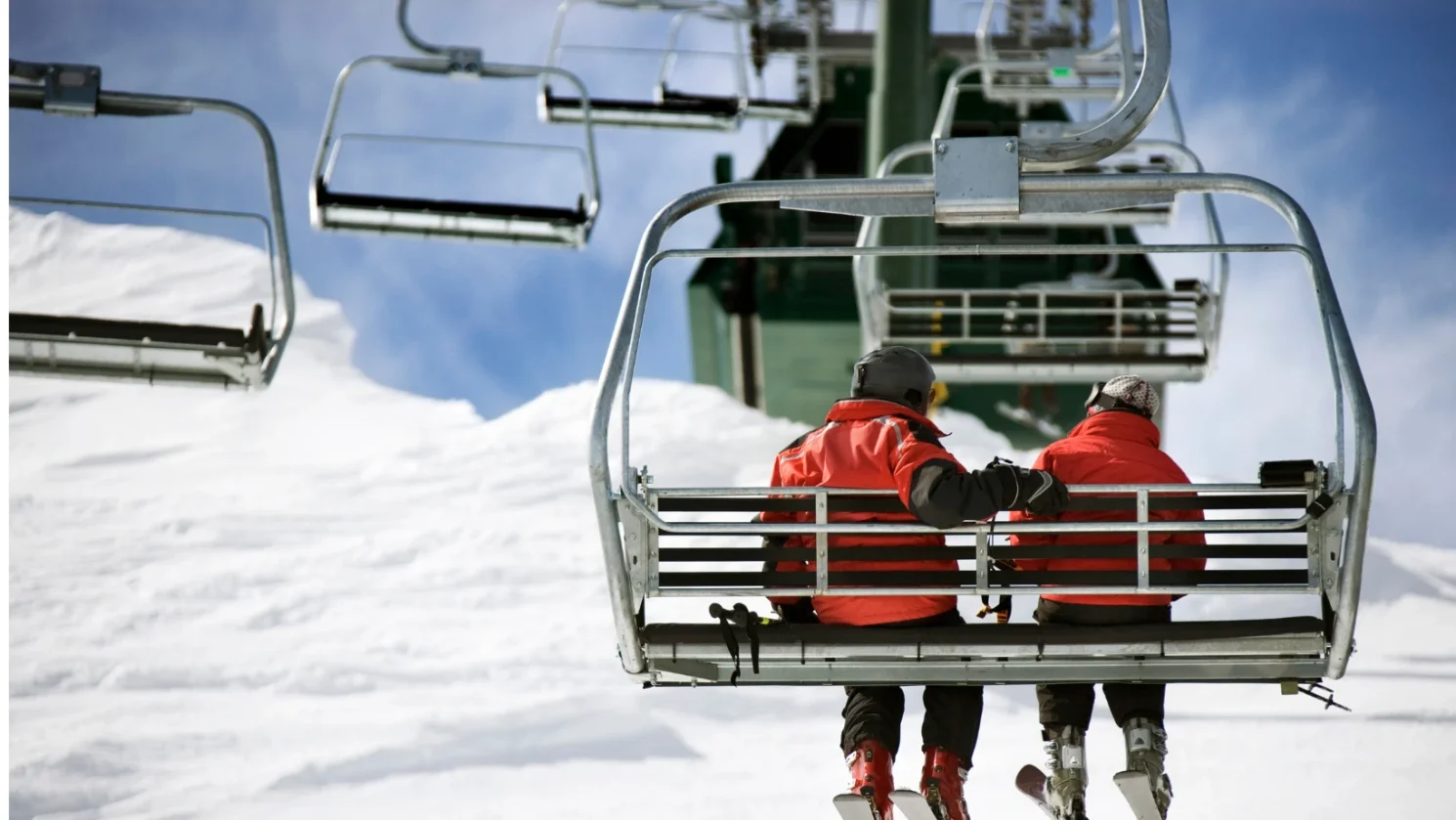 Couple riding Lake Tahoe ski Lifts
