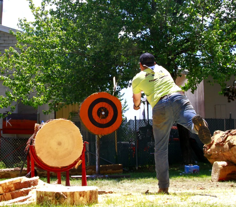 male yellow short axe throwing comp