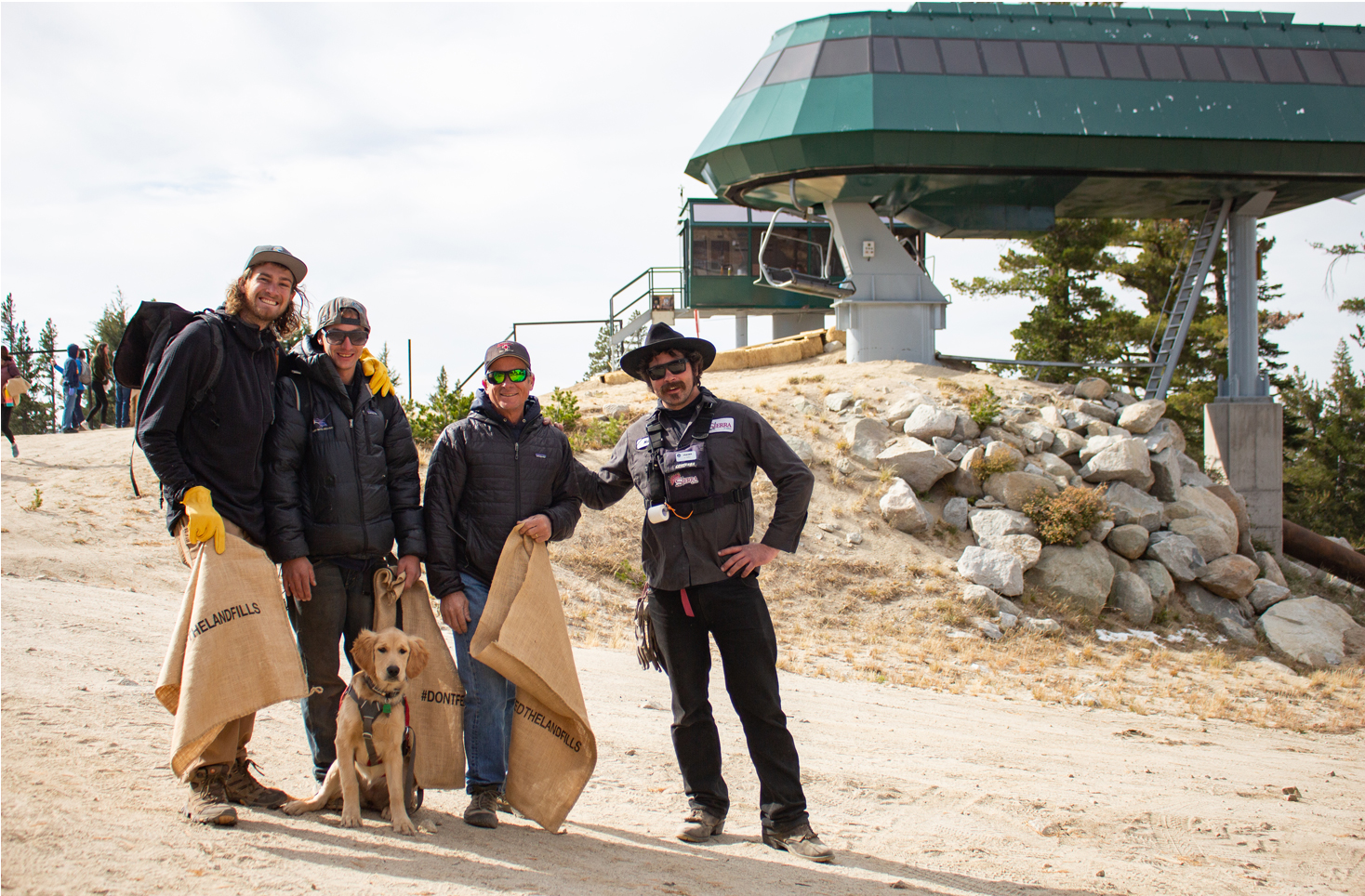 Guys and dog volunteering at ski resort